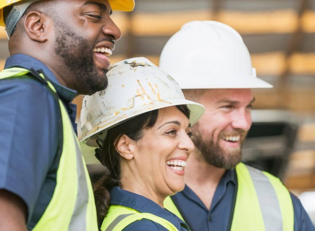 Construction workers laughing in a group